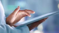 Researcher using a tablet.